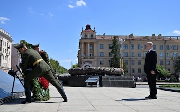 Russian President Vladimir Putin takes part in a wreath-laying ceremony at Victory Monument in Minsk