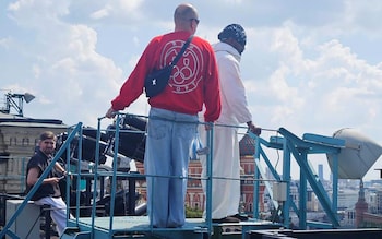 Kanye West (right) pictured in the centre of Moscow