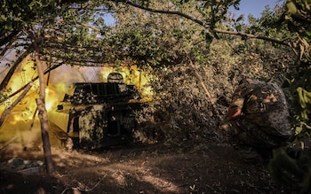 Troops of Ukraine's mechanised brigade of fire a 122mm self-propelled howitzer 'Gvozdyka' in an undisclosed area of the Donetsk region