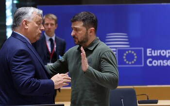 Hungarian Prime Minister Viktor Orban and Ukraine's President Volodymyr Zelensky talk at the EU's summit in Brussels on June 27