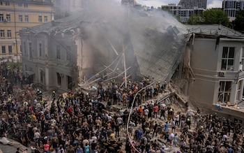 Emergency workers respond at the Okhmatdyt children's hospital hit by Russian missiles, in Kyiv, Ukraine, Monday, July 8, 2024. A major Russian missile attack across Ukraine on Monday killed at least 31 people and injured 154, officials said, with one striking a large childrenâ  s hospital in the capital of Kyiv, where emergency crews searched the rubble for victims.