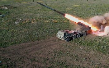 A Russian self-propelled multiple rocket launcher 'Uragan' (Hurricane) fires towards a Ukrainian position on the frontline