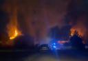 Shocking images show two huge fires ripping through two buildings on same street