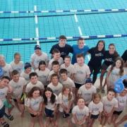 Swimming club members celebrate impressive victory