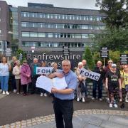 Friends of Hawhead Cemetery gather to hand over a petition