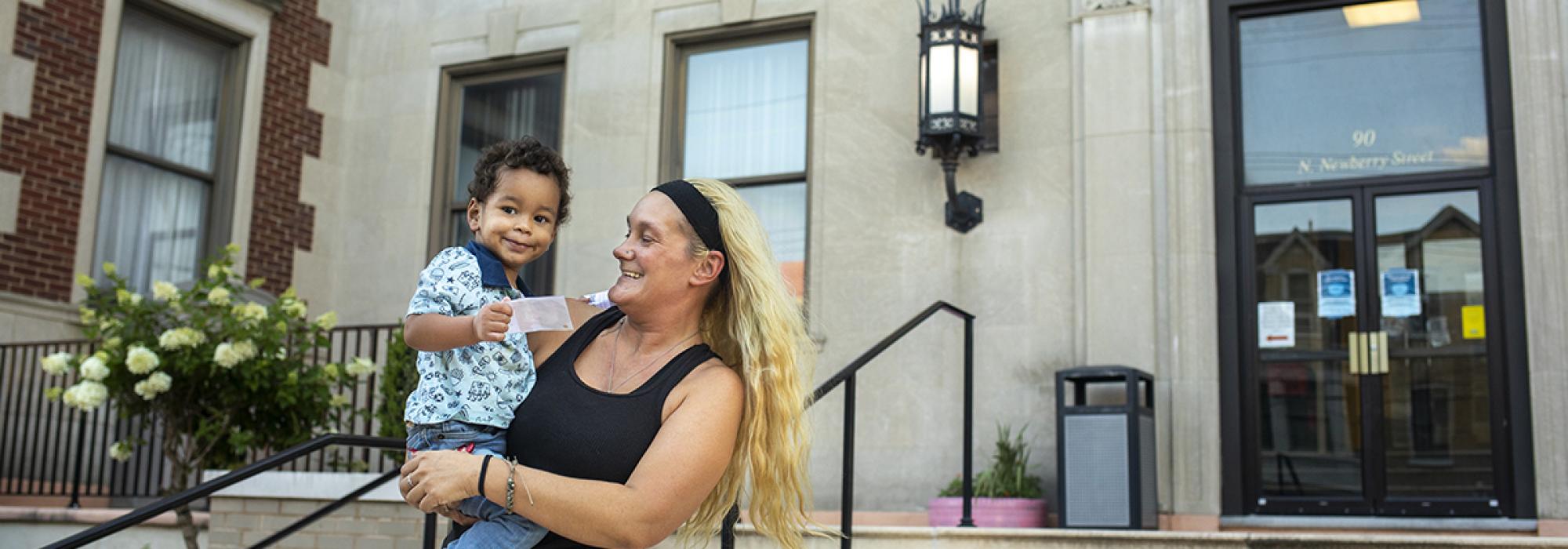 woman holding a young boy