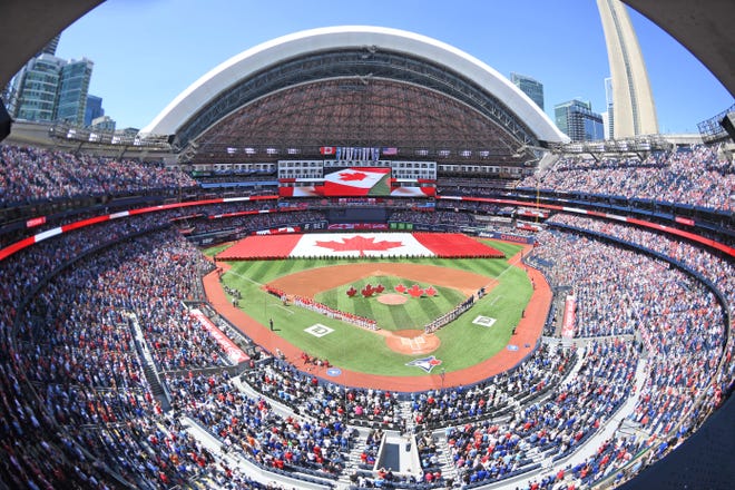 July 1: A Canadian flag is brought onto the field for Canada Day opening ceremonies before the Toronto Blue Jays' game against the Houston Astros at Rogers Centre.