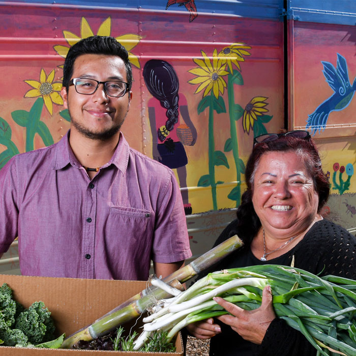 Farmers holding vegetables