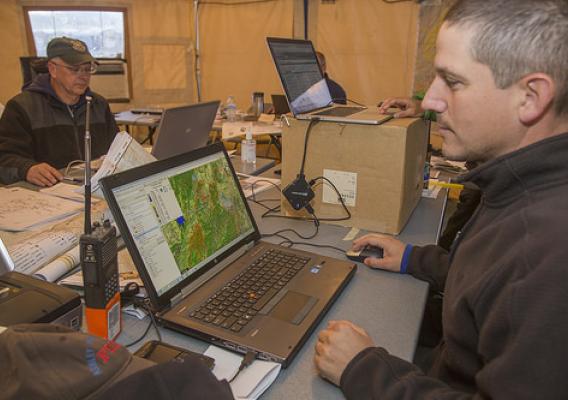 A person looking at a burn severity map