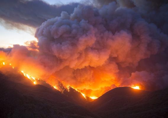 A wildfire with smoke in the air