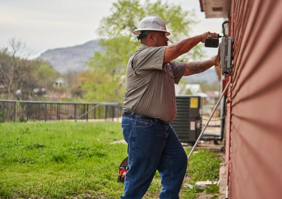 A Hilliary Communications technician installs free Wi-Fi