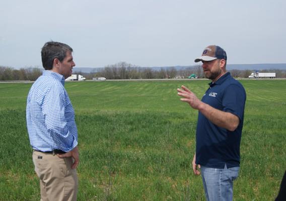 USDA Risk Management Agency Associate Administrator Tim Gannon (left) and Jason Forrester talking about planting plans