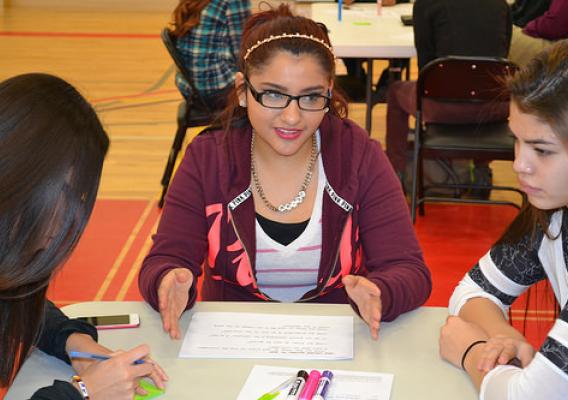 Little Wound School students holding a roundtable discussion