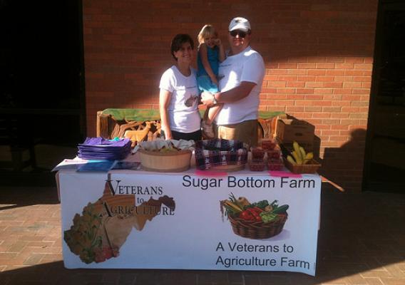 Eric Grandon and his family selling their local food products at a Farmer's Market