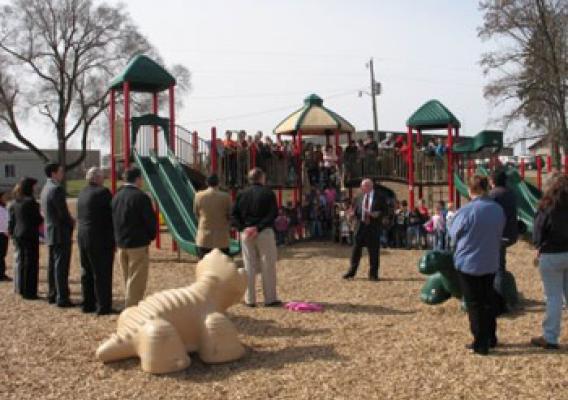 State Director for Michigan James Turner speaks before the new playground at Walkerville