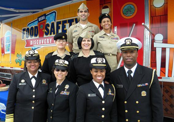 The Food Safety Discovery Zone’s hardworking staff of U.S. Public Health Service Commissioned Corps Officers take a break to pose with Surgeon General Regina Benjamin outside of the exhibit.The Food Safety Discovery Zone’s hardworking staff of U.S. Public Health Service Commissioned Corps Officers take a break to pose with Surgeon General Regina Benjamin outside of the exhibit.