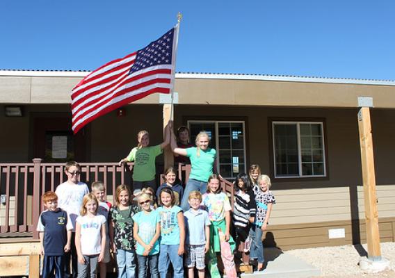 “Green Student Council” after posting flag to the new classroom building