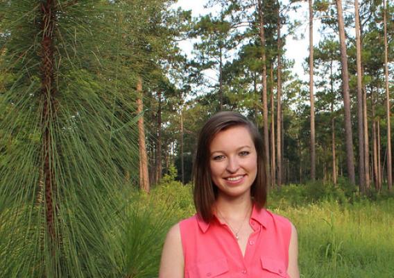 Casey Cox, Executive Director of the Flint River Soil and Water Conservation District, in front of trees