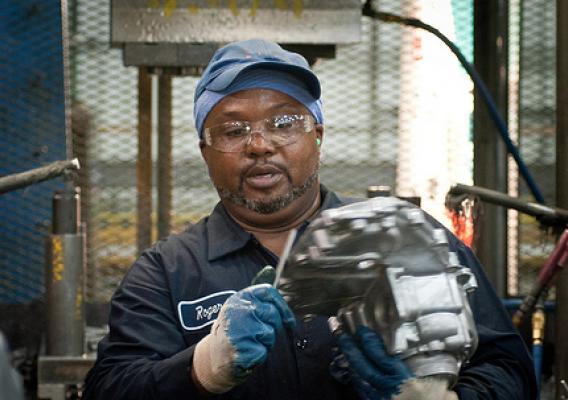 Trim Operator Roger Brown at Port City Group’s Port City Castings Corporation manufacturing high-pressure aluminum die-castings