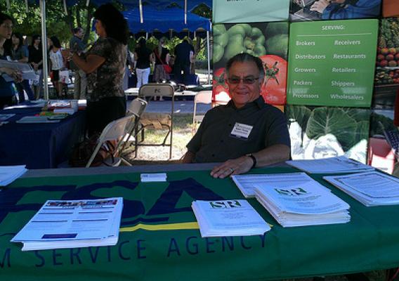 Robert Piceno State Executive Director Arizona State Farm Service Agency, staffs the table for the STEM outreach event at Phoenix Community College.