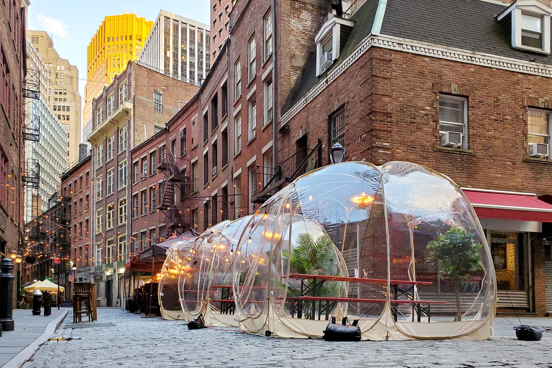 outdoor dining bubbles on a city street