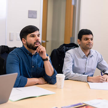 two students sitting together in class