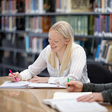 Law student writing in their notebook