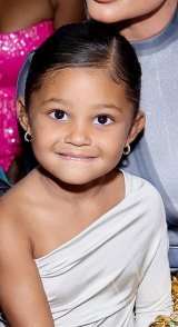 Stormi Webster Smiles in White Dress