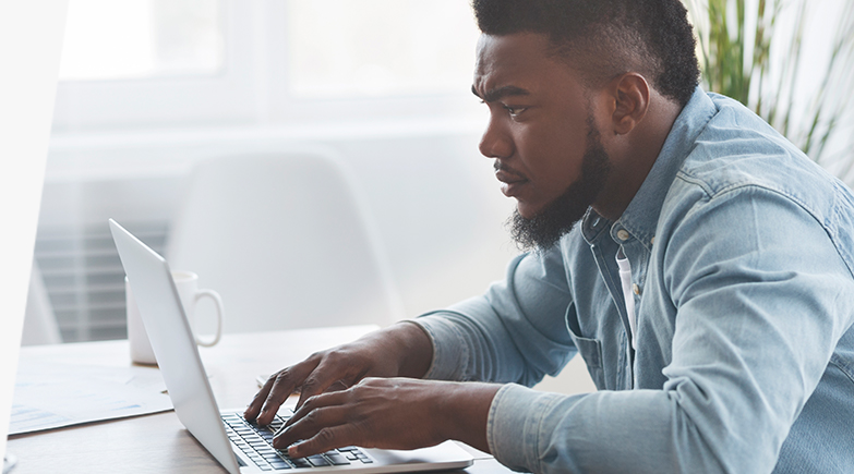 Man using a laptop.