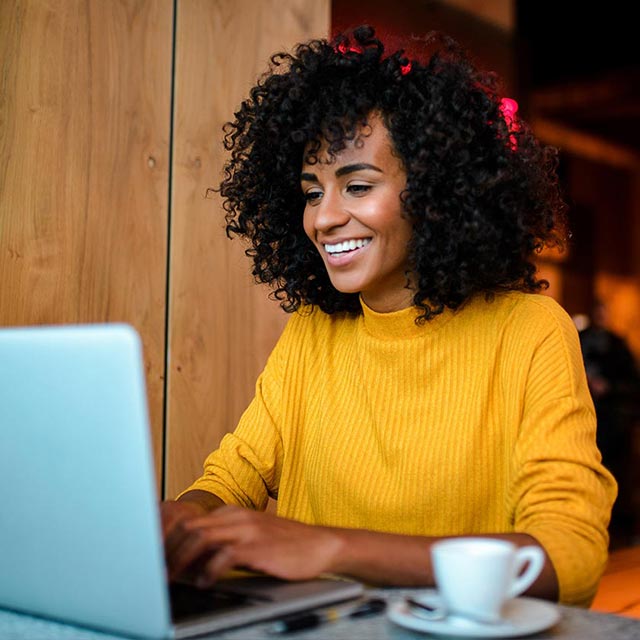 A woman using her laptop to make a secure online payment.