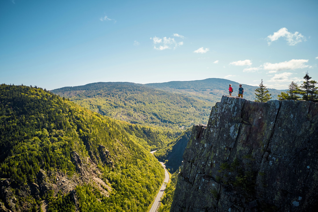 hikers on a mountain ledge