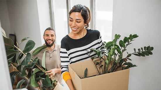 Happy couple moving into a new home.