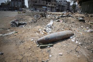 An unexploded missile fired by an Israeli aircraft lies among the rubble, amid the ongoing conflict between Israel and Hamas, in the northern Gaza Strip - source: Reuters