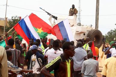 Demonstators wave Russian and Burkina Faso flags during an international conference in Ouagadougou in 2022 - source: Reuters