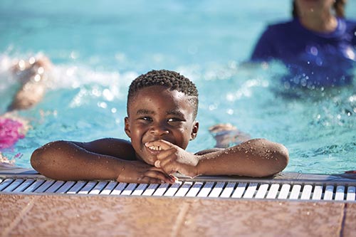 Boy at pool's edge