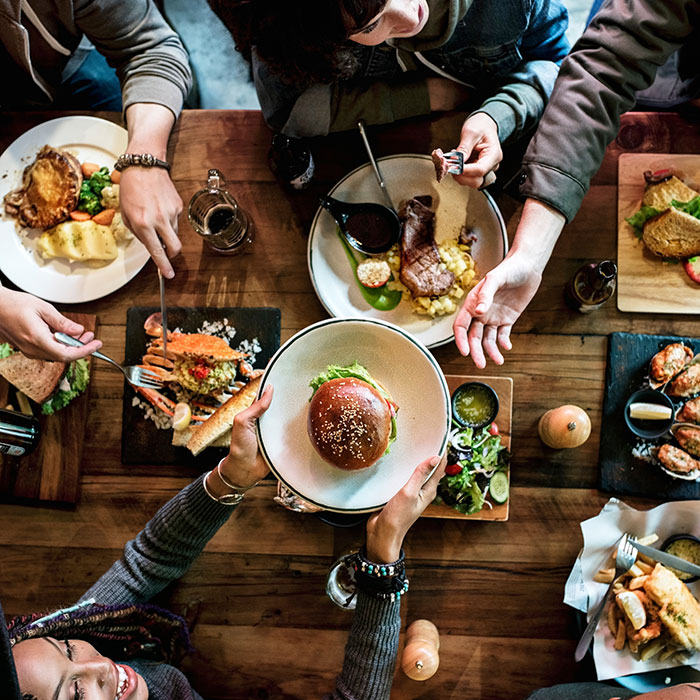 people-passing-plates-food