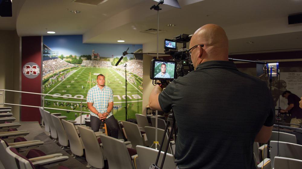 Image of Dak being filmed for colon cancer screening PSAs.