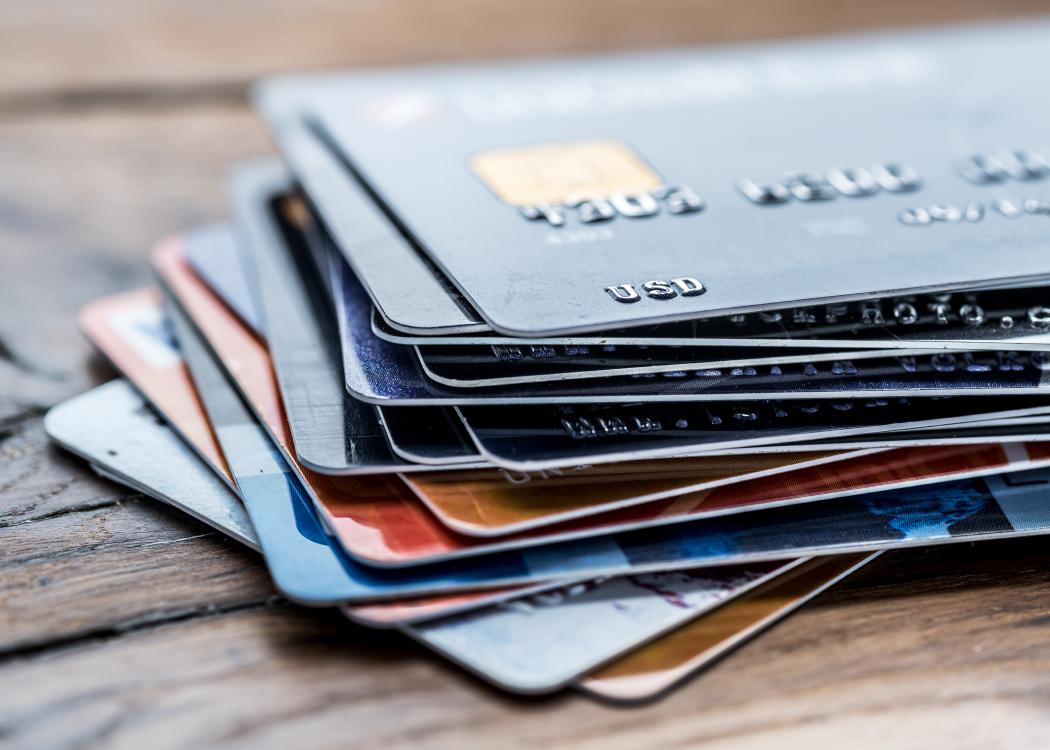 Credit cards laying on a table.