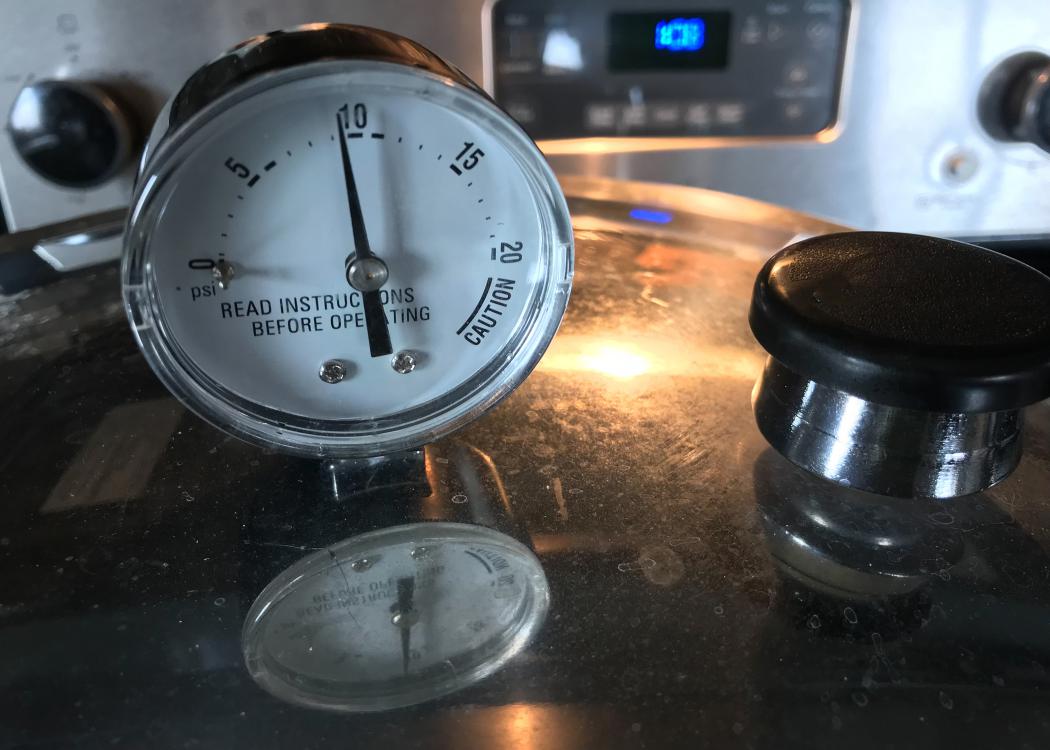 Closeup of a dial on a pressure canner.