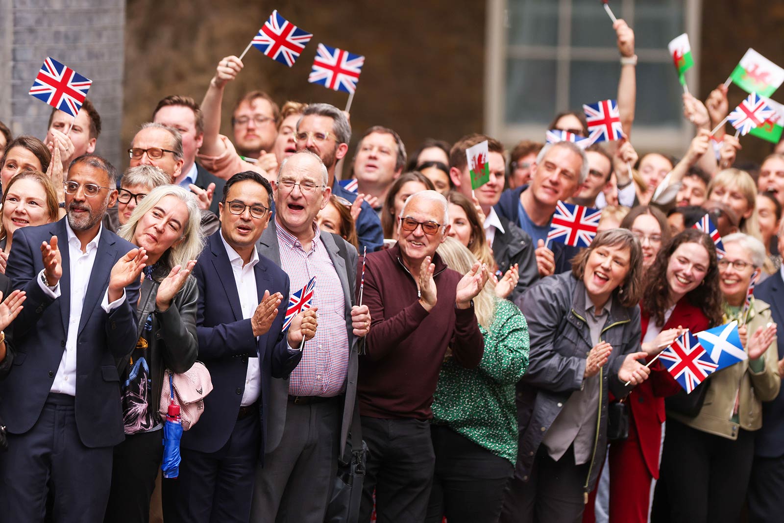 Supporters react as Keir Starmer arrives at 10 Downing Street - 5 July 2024