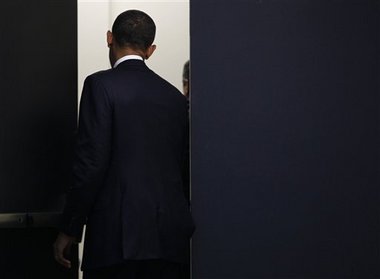 barack-obama-black-curtain-walk-away-122210.jpg