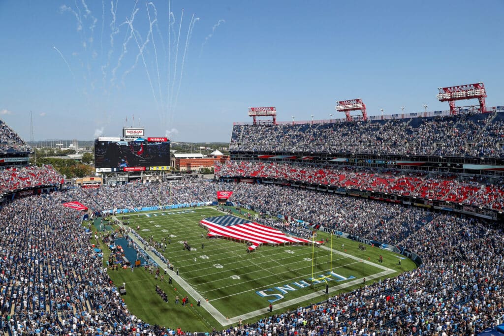 An American flag in the shape of the country is rolled out during the opening ceremony of the Tennessee Titans and Indianapolis Colts game at Nissan Stadium Sunday, Sept. 15, 2019 in Nashville, Tenn. Ht1 8363