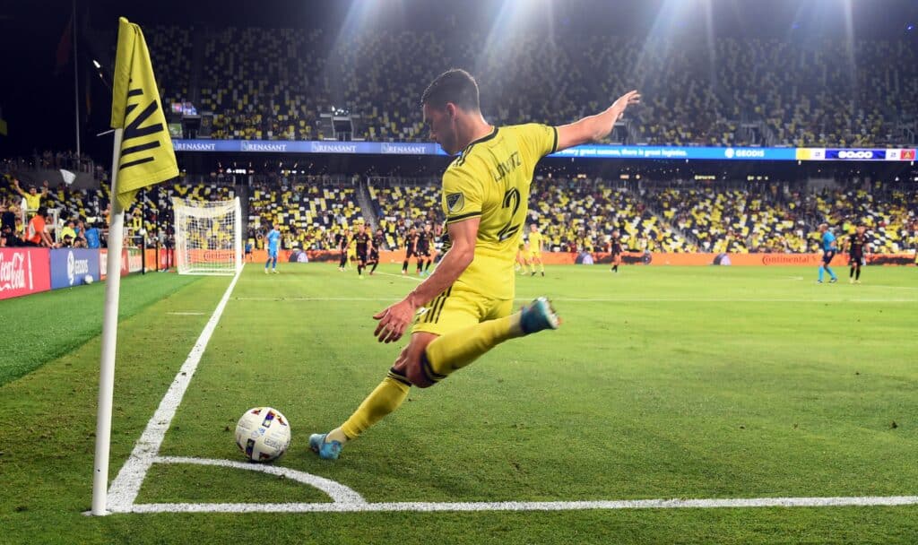 May 21, 2022; Nashville, Tennessee, USA; Nashville SC defender Daniel Lovitz (2) attempts a corner kick against Atlanta United during the second half at GEODIS Park. Mandatory Credit: Christopher Hanewinckel-USA TODAY Sports