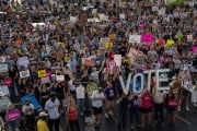 Letters forming the word VOTE are seen as abortion rights activists protest outside the Planned Parenthood Reproductive Health Services Center after the overturning of Roe v Wade by the Supreme Court.