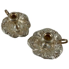 Gorham Sterling Silver Floral Repoussé Chambersticks, circa 1920-1930, a Pair