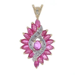 Yellow Gold Ruby & Diamond Pendant - 10k Oval & Marquise 2.10ctw Swirl