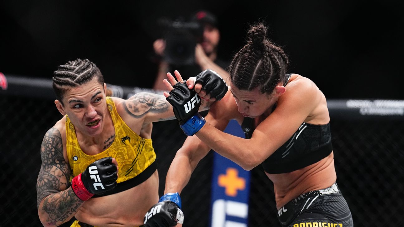 Jessica Andrade of Brazil punches Marina Rodriguez of Brazil in a strawweight fight during the UFC 300 event at T-Mobile Arena on April 13, 2024 in Las Vegas, Nevada.