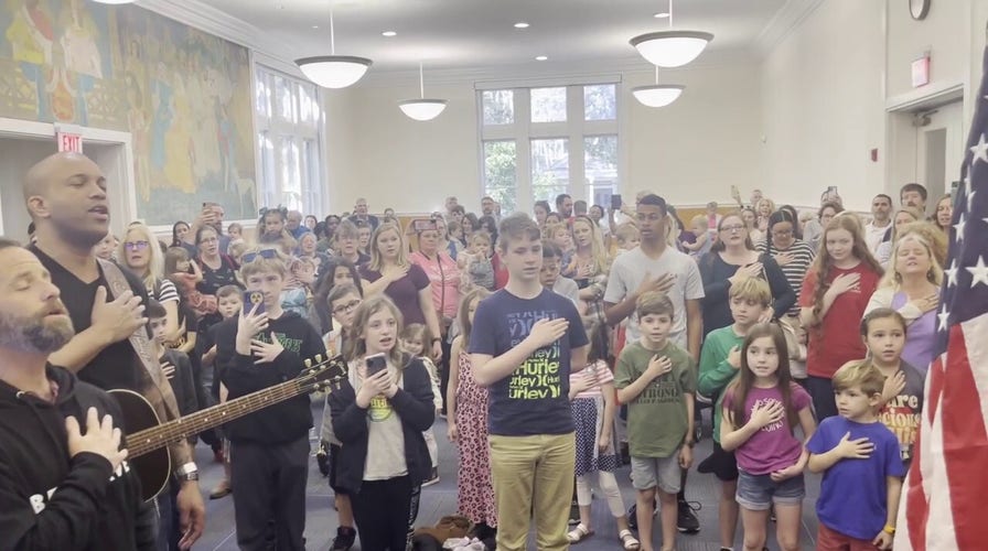 National anthem sung by Kirk Cameron, Coffey Anderson, families in Georgia