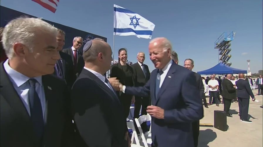 Biden shakes hands with Netanyahu during Middle East trip