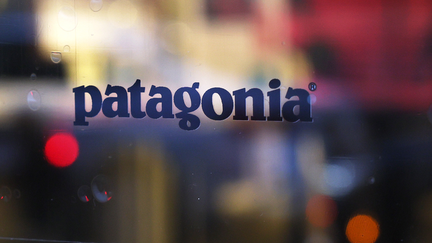 A Patagonia sticker is seen on a door at a store on Greene Street on September 14, 2022 in New York City. Yvon Chouinard, founder of Patagonia, his spouse and two adult children announced that they will be giving away the ownership of their company which is worth about $3 billion. The company's privately held stock will be now be owned by a climate-focused trust and group of nonprofit organizations, called the Patagonia Purpose Trust and the Holdfast Collective, and all the profits that are not reinvested into the business will be used to fight climate change. 